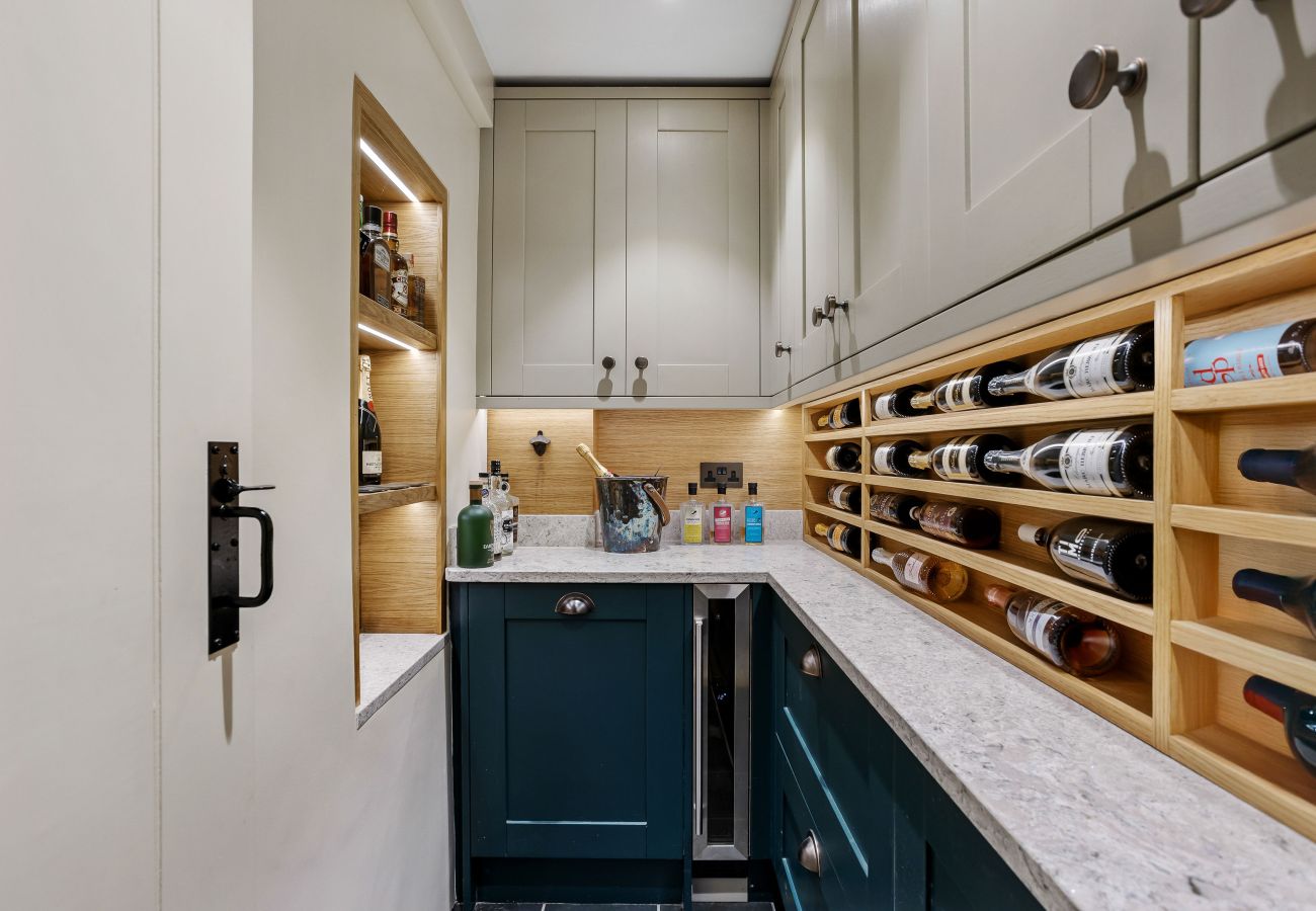 Wall wine rack beside prep counter