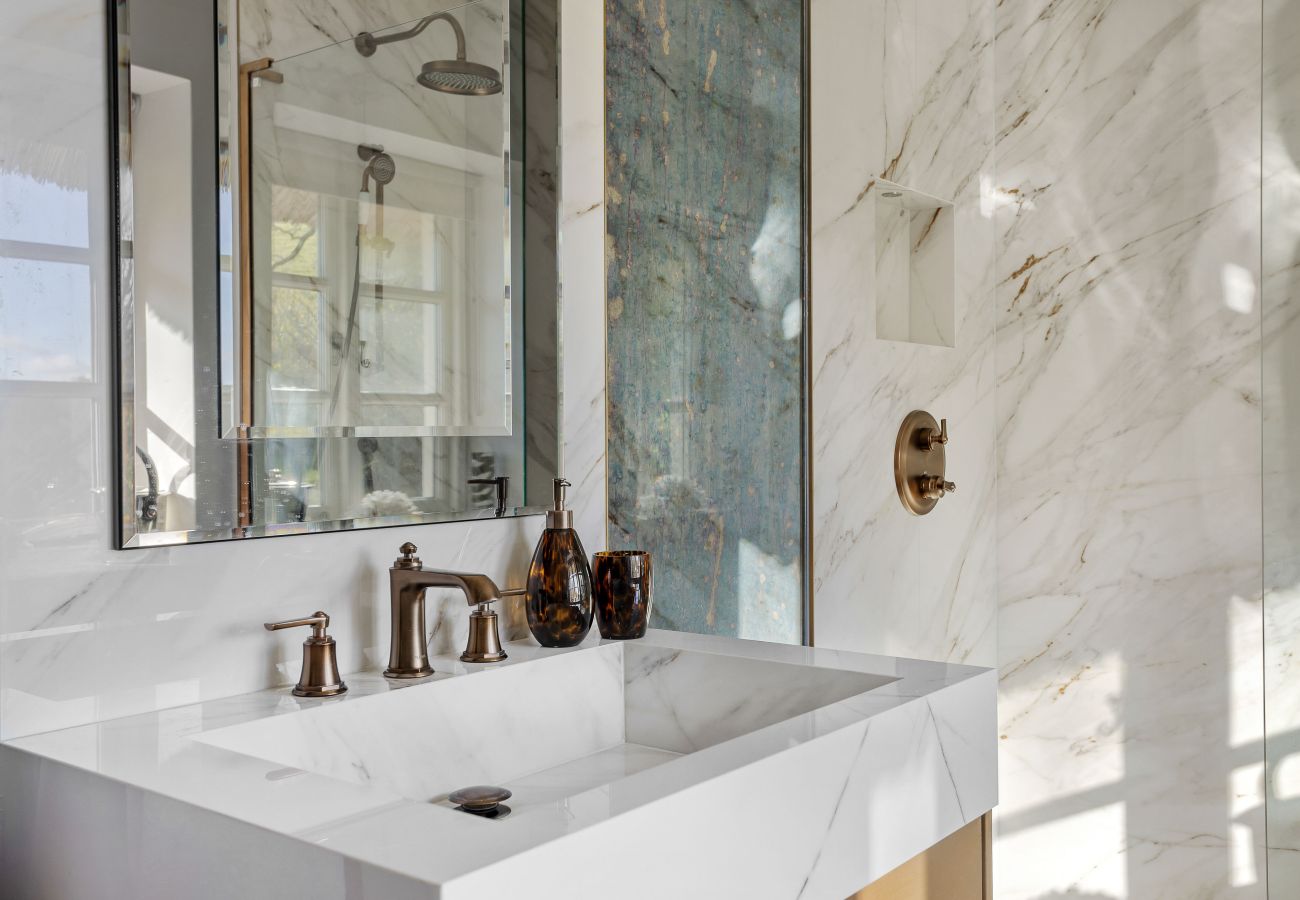 Bathroom vanity with marble tiles