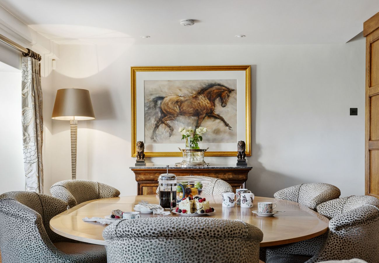 Bright sitting room with armchairs and painting