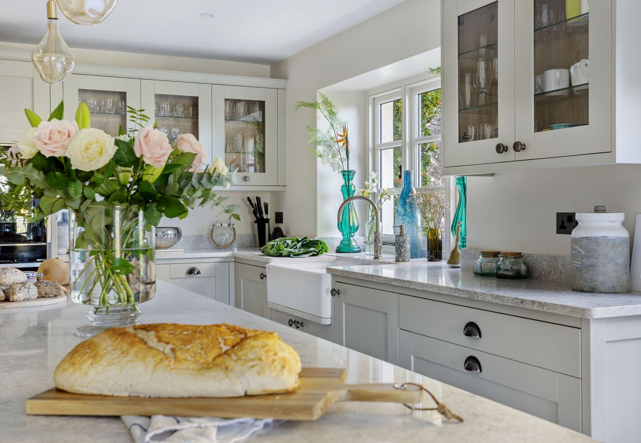 Bright luxury kitchen with island seating