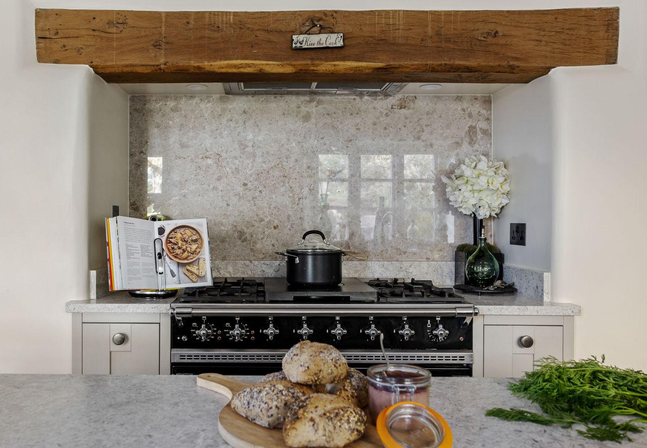 Range cooker beneath rustic wooden beam