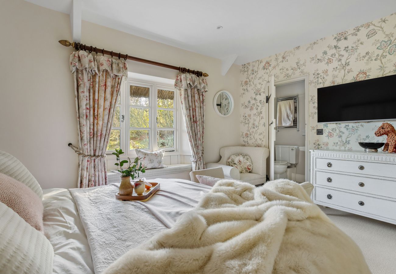 Double bed in bright floral room