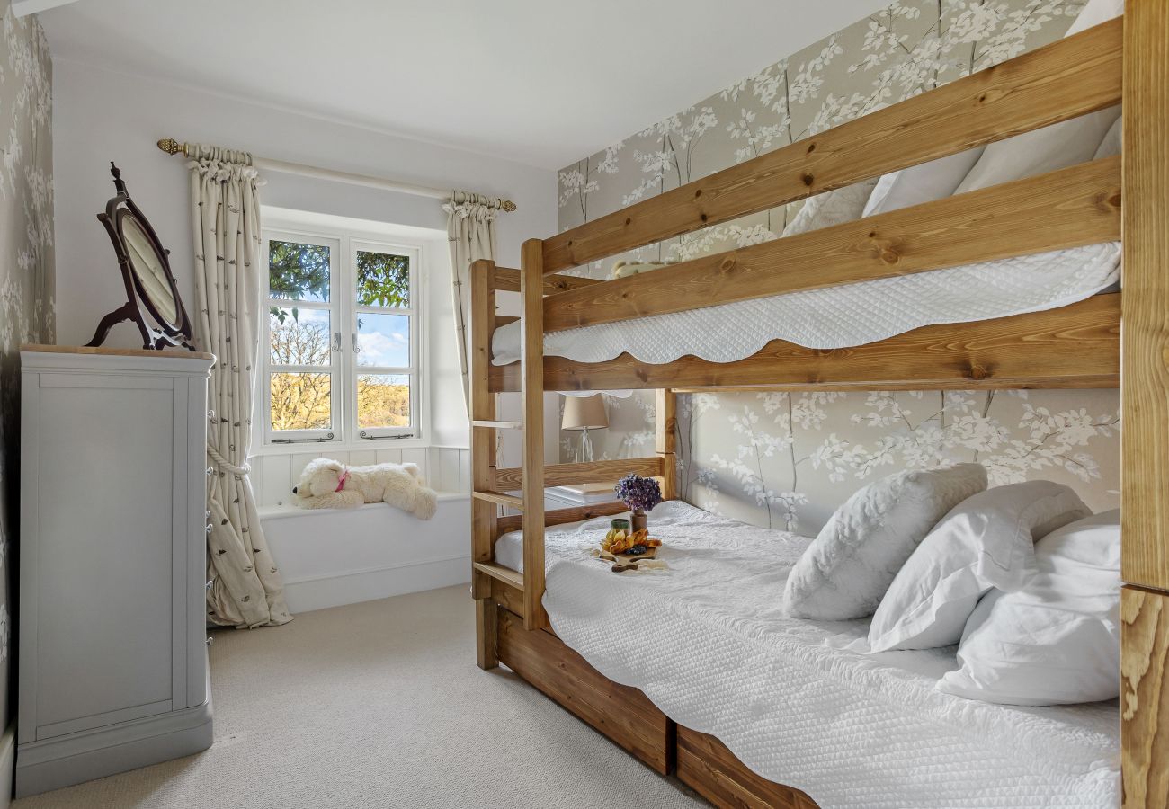 Bunk beds beside doors to garden
