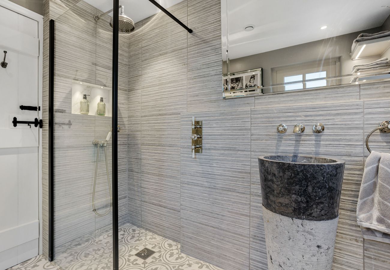 Tiled walk-in shower with rainfall head