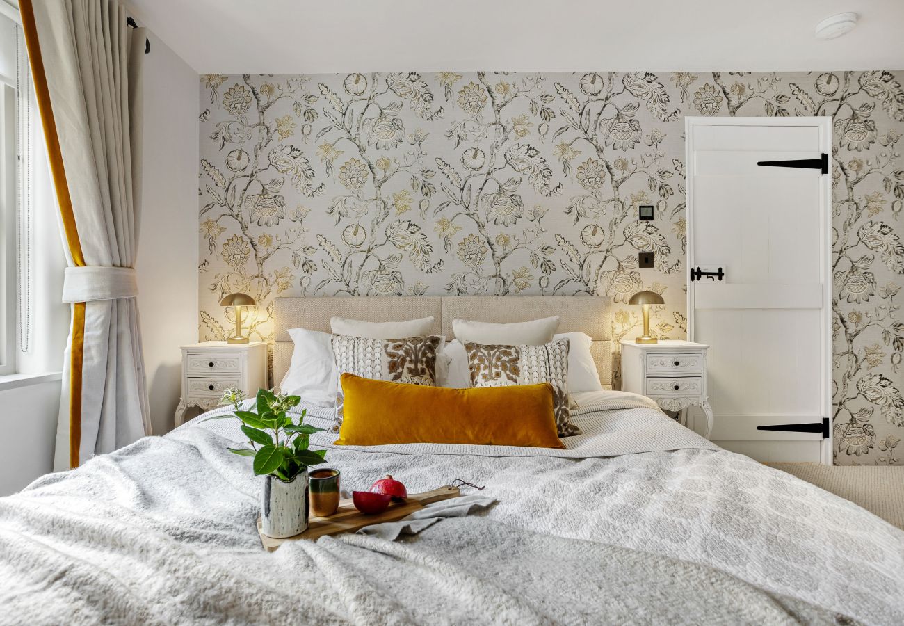 Bright bedroom with decorative wallpaper