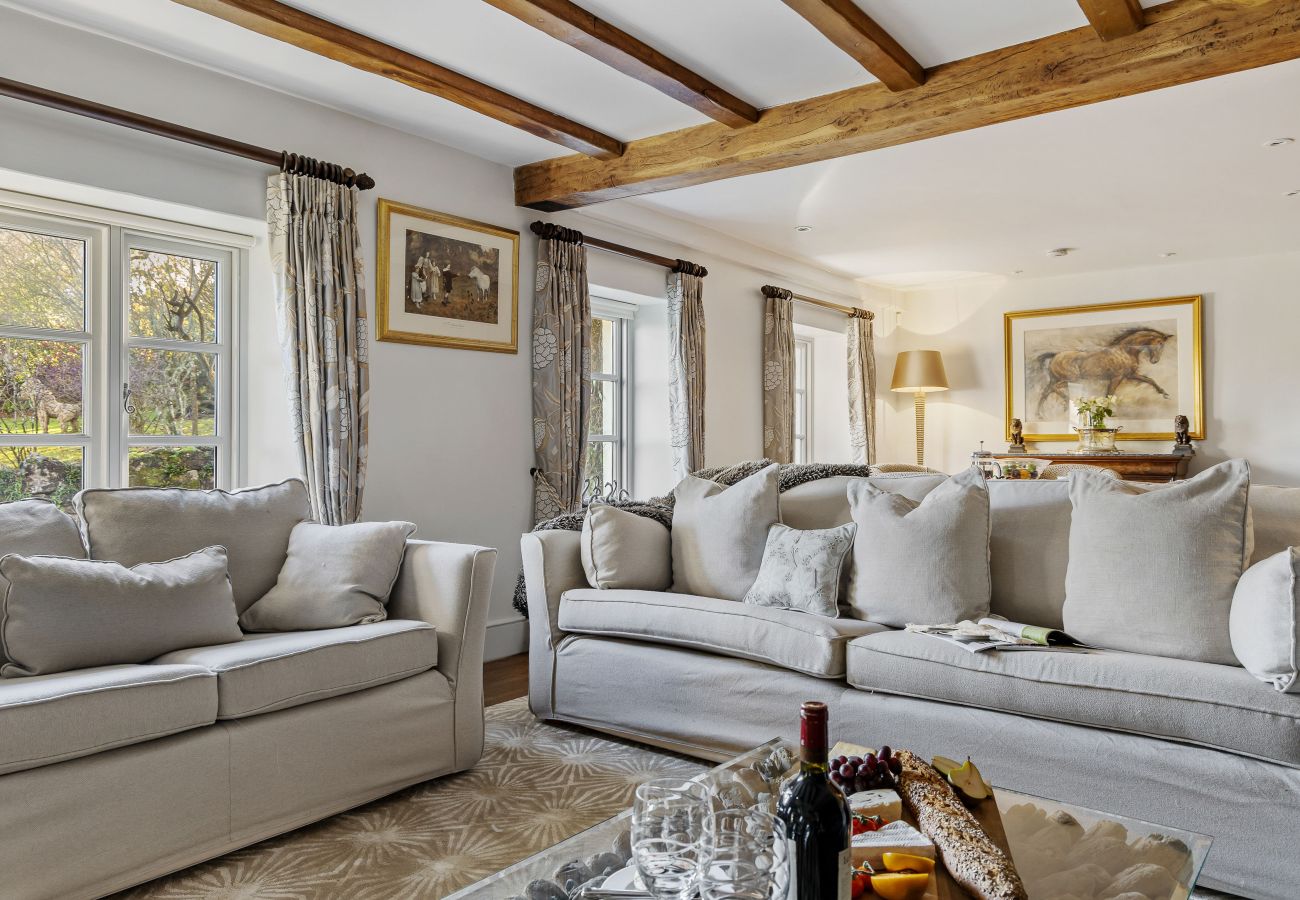 Beamed lounge with sofas and artwork