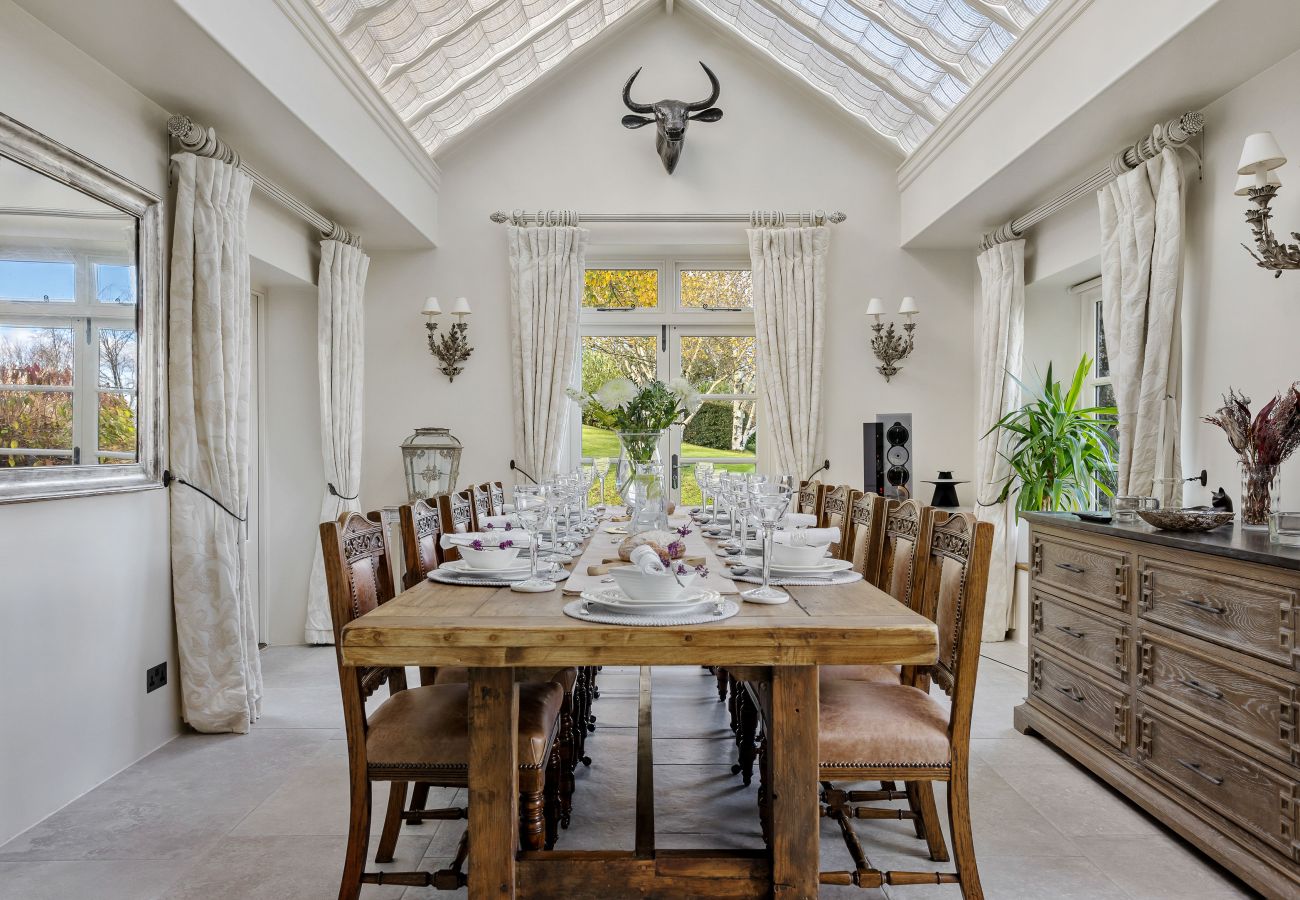 Dining table in airy conservatory
