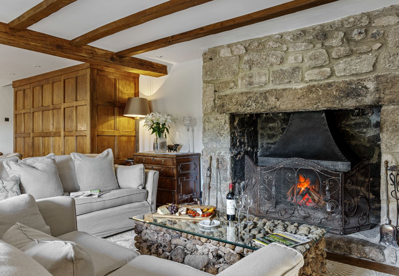 Stone fireplace in bright, open living room
