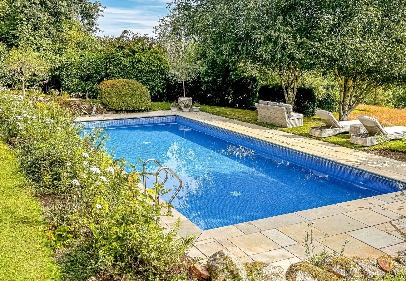 Outdoor pool in landscaped garden, Woodtown, Chagford.