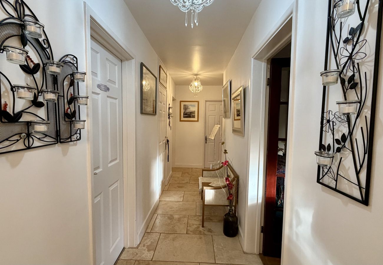 Interior hallway leading to bedrooms at Pheasants Haunt family-friendly holiday home in Devon